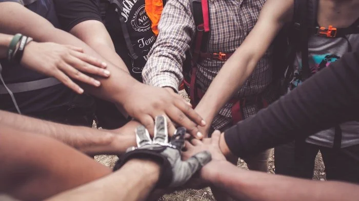 Patients holding hands at a drug and alcohol rehab centre in Devon