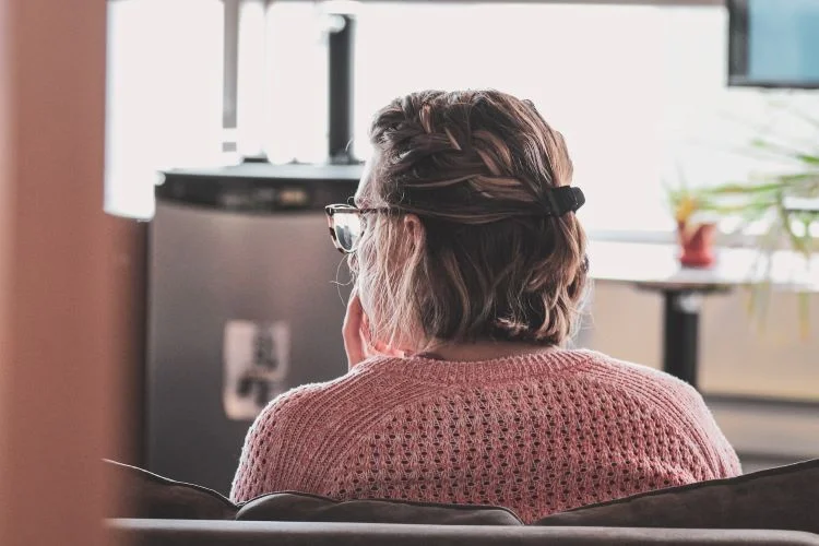 Woman sat in thought at a drug and alcohol rehab centre in Lincolnshire