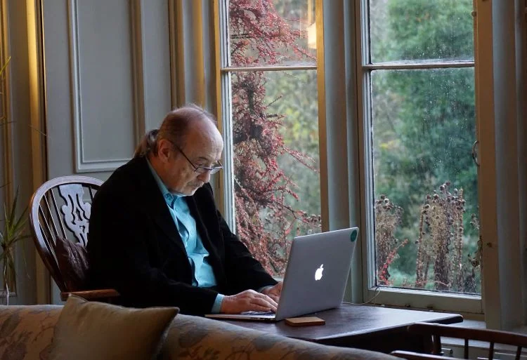 Man sitting at laptop