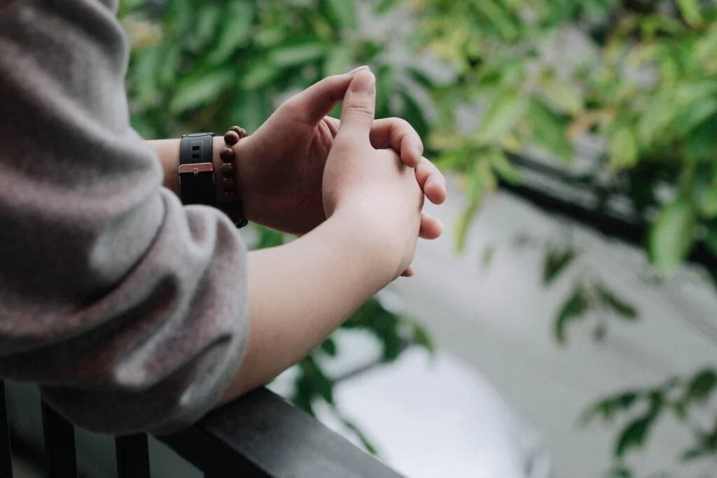 A person with their hands clasped in Sunderland