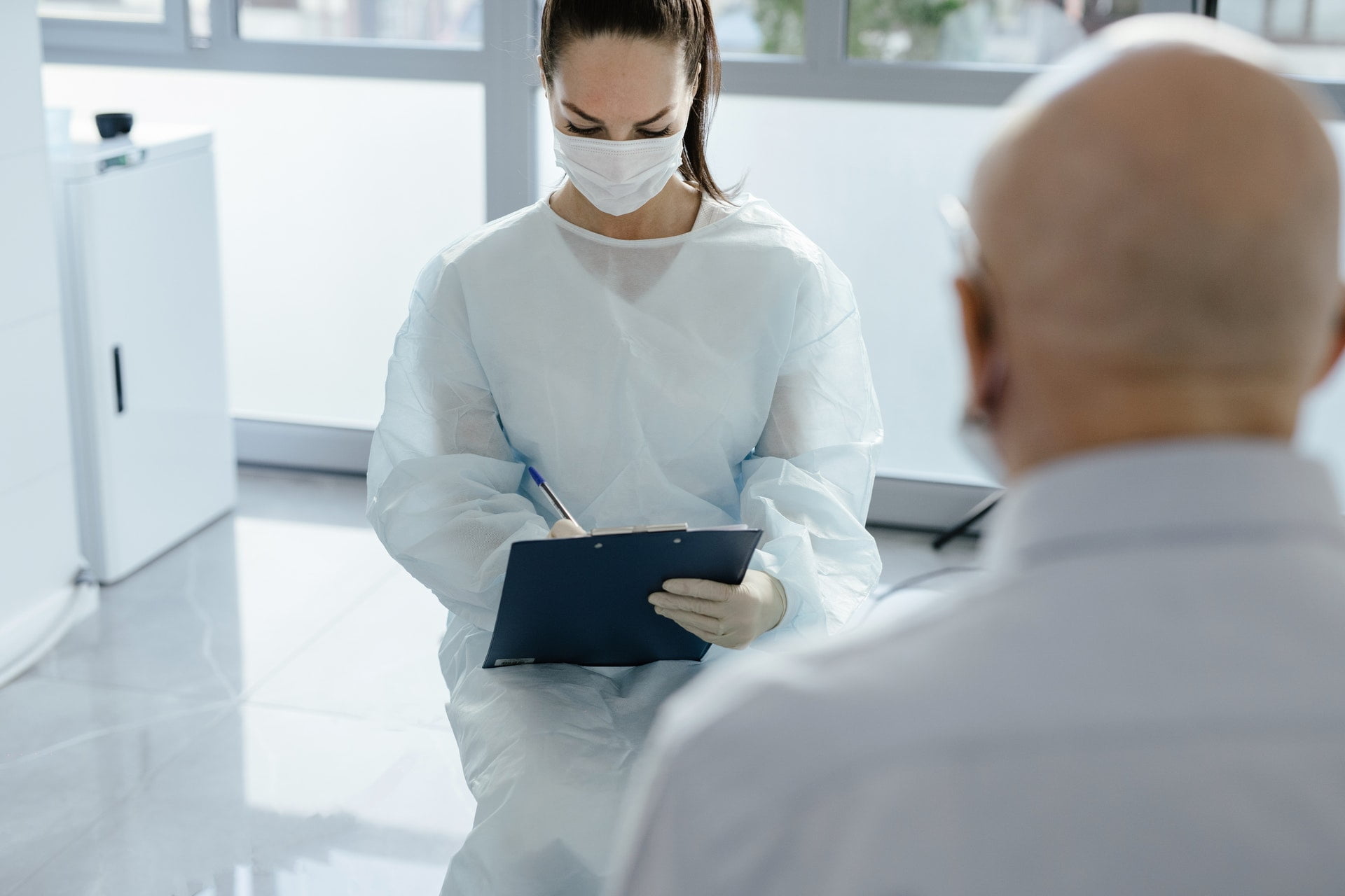 Doctor talking to a patient about Urinary Tract Infections (UTIs)