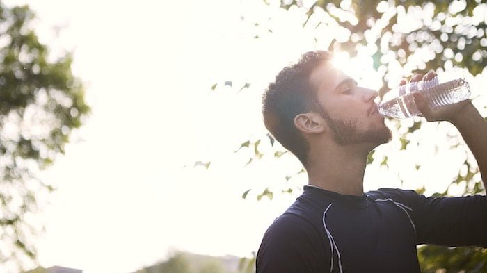 Man hydrating to avoid a Urinary Tract Infection (UTI)