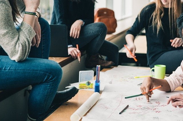 Peers working together during an addiction recovery meeting